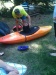 Rhiannon playing hide and seek in the hardshell kayak